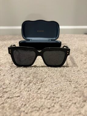 Current Gucci Black Sunglasses with Gold Stud Accents GG1084S
